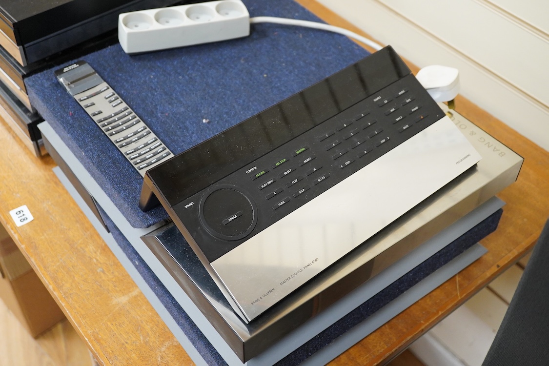 A Bang and Olufsen 6500 hi-fi system, comprising of a Beocord 6500, a Beogram CD 6500, a Beomaster 6500, and a master control panel, together with a pair of floor standing pedestal speakers, 164cm high, and pair of type
